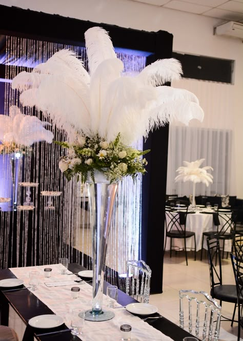 Feather Centerpiece Wedding, Harlem Nights Theme, Sweet 16 Centerpieces, Christmas Balloon Decorations, Cowboy Theme Party, Blue Centerpieces, Feather Centerpieces, Gatsby Theme, White Centerpiece