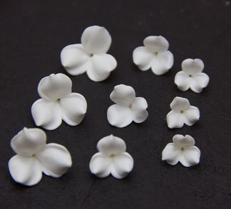 "White flowers beads with three petals 0.4 \"(1 cm), 0.6\" (1.5 cm), 0.8 \"(2 cm) made of polymer clay. You can choose the color and quantity. Each flower is handcrafted. The hole orientation hole in the center of the flower The hole can be enlarged with a needle if necessary. These beautiful handcrafted polymer clay beads are ideal for making bridal tiaras, hairbands, hair pins, wedding hair comb * Materials: Premo, Fimo & Sculpey polymer clays If you need more flowers or other color of flo Tiara Making, Beads Clay, Flowers Beads, Beads Polymer Clay, White Iris, Blush Flowers, Pink Clay, Polymer Clay Flowers, Iris Flowers