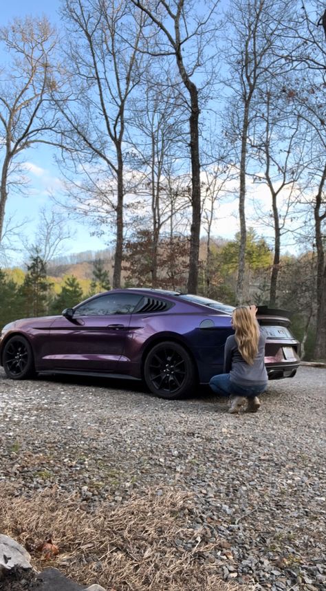 Picture is of a 20 17 mustang GT in midnight purple three wrap. Girl with sandy blond hair is squatted down near the rear part-of the car. Mountains scenery behind. Midnight Purple Vinyl Wrap, Dark Purple Mustang, Dark Purple Car Wrap, Purple Wrapped Car, Mustang Wrap Ideas, Midnight Purple Car, Mustang Purple, Purple Car Wrap, Sn95 Mustang