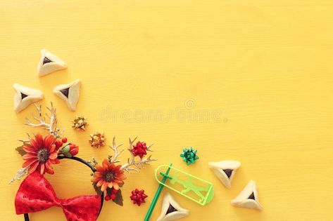 Purim celebration concept jewish carnival holiday over yellow wooden background. , #AD, #carnival, #holiday, #yellow, #jewish, #Purim #ad Purim Celebration, Carnival Holiday, Celebration Images, Floral Decoration, Wooden Background, Purim, Deer Antlers, Infographic Design, Antlers