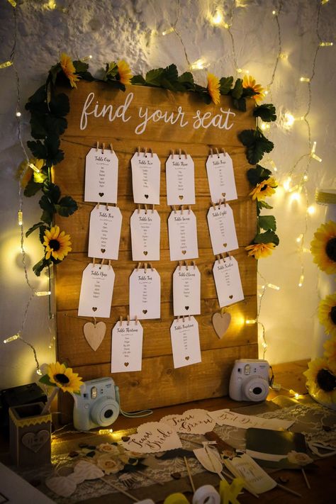 How To Style A Sunflower Themed Wedding ⋆ Unconventional Wedding Sunflower Seating Chart, Sunflower Wedding Decor Ideas, Sunflower Themed Wedding Decoration, Sunflower For Wedding, Wedding Table Decorations Sunflowers, Sunflower Wedding Table Decorations, Wedding Decorations Sunflowers, Wedding Sunflower Theme, Boho Sunflower Wedding