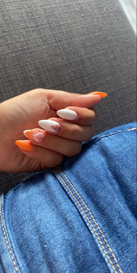 White Nails With Orange Glitter, White Nails With Orange Heart, Orange And White Almond Nails, Orange And White Nails Ideas, White With Orange Nails, Orange Graduation Nails, White And Orange Nail Designs, Orange Nails Almond Shape, White Orange Nails