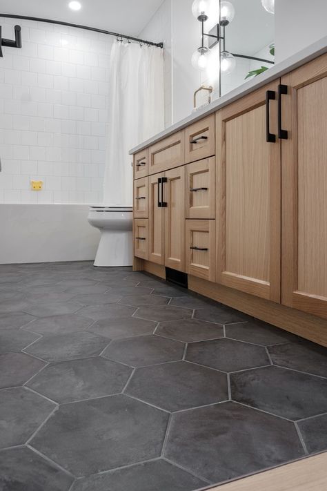 Black White Gray Wood Bathroom, Bathroom Vanity And Floor Ideas, Bathroom And Kitchen Tile Floor, Accent Floor Tile Bathroom, Bathroom Gray Floor White Vanity, Bathroom Design Black Floor, Bathroom Remodel Honeycomb Tile, Textured Bathroom Floor, Galley Kitchen Floor Tile