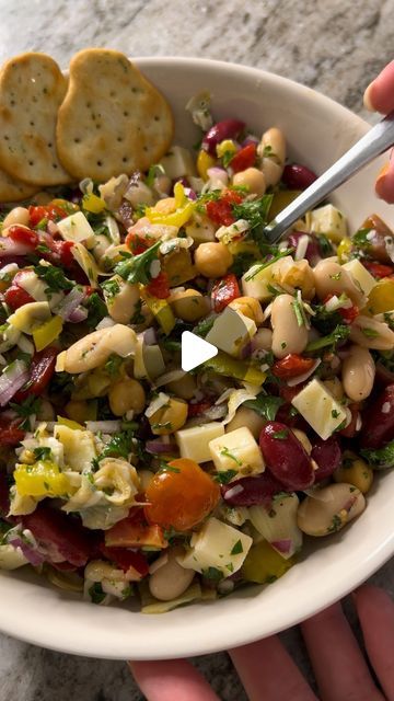 Emily Hanka on Instagram: "me and beans was like peas and carrots 😌💞 recipe below!!
.
ANTIPASTO THREE-BEAN SALAD
.
For the salad:
- 3 (15-oz) cans beans of choice, rinsed and drained (I used garbanzo, kidney and cannellini beans but feel free to choose your own adventure)
- 1 (15-oz) can artichoke hearts, drained and roughly chopped
- 1 (12-oz) jar roasted red peppers, drained and roughly chopped
- 1 cup hot pepperoncini rings, roughly chopped
- 1/2 pint cherry tomatoes, quartered
- 1/2 red onion, diced
- 1/2 large bunch parsley, chopped
- 4 oz low-moisture part-skim mozzarella, cubed
- 2 oz Parmesan cheese, shredded
.
For the dressing:
- 1/4 cup extra-virgin olive oil
- 2 Tbsp red wine vinegar
- 2 Tbsp freshly squeezed lemon juice
- Optional squeeze of honey or agave nectar
- 1 Tbsp dri Antipasto Three Bean Salad, Canned Red Kidney Bean Recipes, Roasted Vegetable Salad Recipes, Peas And Carrots Recipe, Bean Salads, Italian Appetizer, Three Bean Salad, Peas And Carrots, Carrots Recipe