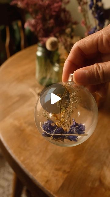 Sibia Torres Padilla | DIYs on Instagram: "Last year we got a bag of glass ornaments at goodwill and filled them with dried flowers. 
If I don’t press my flowers I like to tie them with a piece of twine and hang them upside down until they dry. 
I love using the dried florals for different projects and this was such a simple one. 
Honestly soo simple, and I really enjoyed hanging them over our faux fireplace 😄" Dried Florals, Faux Fireplace, November 13, Upside Down, My Flower, Glass Ornaments, A Bag, Twine, Dried Flowers