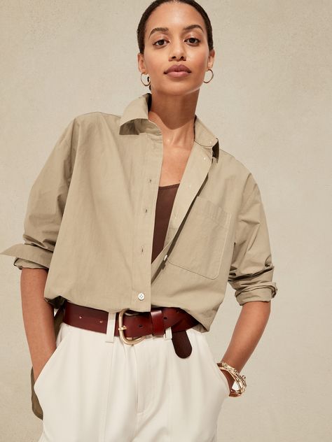 Cut with ease and crafted from our washed cotton poplin, this oversized shirt has high slits at the sides to show off high-waisted styles.  OVERSIZED FIT: Relaxed fit with a dropped shoulder.  Point collar.  Chest pocket.  Button front.  Shirttail he Oversized Poplin Shirt, Mom Denim, High Waist Fashion, Blouse Outfit, Tunic Shirt, Cut Shirts, Poplin Shirt, Oversized Shirt, Cotton Poplin