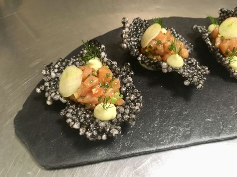 Squid Ink crackers, salmon tartar, Granny Smith apple, Greek yogurt avocado mousse. Tapioca Cracker Recipe, Salmon Tartare Plating, Tapioca Crackers, Greek Yogurt Mousse, Apple Greek Yogurt, Amuse Bouche Ideas, Salmon Tartar, Staff Canteen, Salmon Tartare