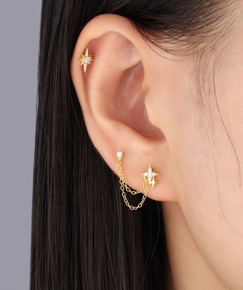 🌟 Shine bright with our stunning Twinkling Star Chain Earrings! 🤩 #oumojewelry #earpiercing #earstyling #earrings #piercingjewelry Two Earings Piercings, Chain Piercing, Chain Earrings Gold, Earrings With Chain, Gold Chain Earrings, Ear Chain, Ear Style, All Ideas, Star Chain