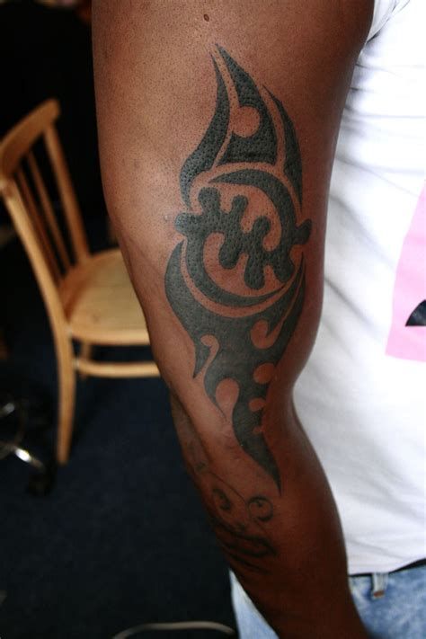 Tribal Tattoos Are Symbols Inked From Different Tribal Gye Nyame Tattoo, Ghana Tattoo, Caribbean Tattoo Ideas, Adinkra Tattoo, Caribbean Tattoo, African Sleeve Tattoo, Angel Wings Clip Art, Arm Tattoos For Guys Forearm, Ankh Tattoo