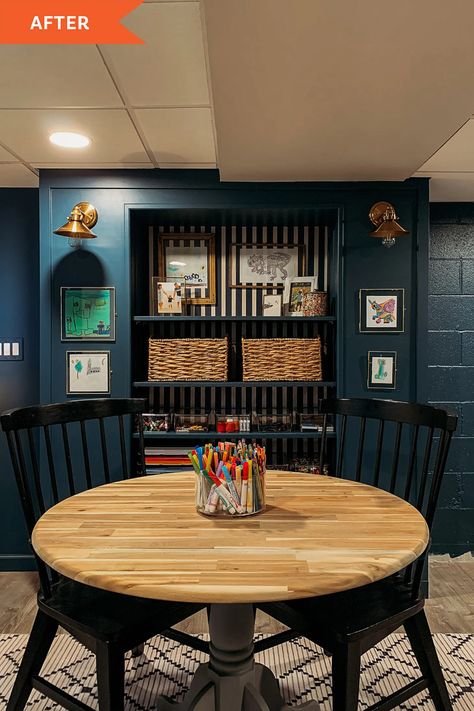 Basement Redo with Navy Paint - Before and After Photos | Apartment Therapy Basement Refinishing, Curved Cabinets, Bold Paint Colors, Basement Redo, Reclaimed Wood Floating Shelves, Navy Paint, Cozy Basement, Small End Tables, Living Room Redo