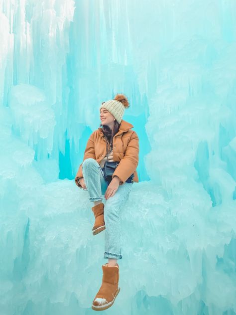 Tips for Visiting the Ice Castles in Midway, UT, woman wearing pompom beanie, tan puffer coat, and Uggs boots sitting on ice - Palm Trees and Pellegrino Travel Tips Ice Castle Photoshoot, Castles Photography, Pastel Photoshoot, Utah Ski Trip, Nevada Day, Southwest Photography, Blogger Photoshoot, Midway Utah, Christmas Instagram Pictures