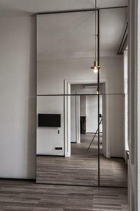 Making Mirrored Walls Modern: Seven Ideas to Steal | Apartment Therapy Mirrored Walls, Minimalism Living, Spiegel Design, Big Mirror, Interior Minimalista, Mirrored Wall, Wooden Floors, غرفة ملابس, Modern Mirror