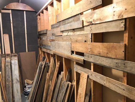 Pallet Wall Garage, Basement Pallet Wall Ideas, Garage Pallet Wall, Burnt Pallet Wood Wall, Pallet Walls Diy, Pallet Wood Walls Living Room, Wall Material Ideas, Shed Wall Ideas, Pallet Board Wall