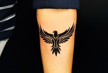 Top 40 Best Eagle Tattoos Designs [2023] Simple Eagle Tattoo Men, Eagle Tattoo For Men On Arm, Small Eagle Tattoo Men Forearm, Forearm Tattoo Men Eagle, Eagle Wrist Tattoo Men, Name Back Tattoo For Women, Eagle Small Tattoo, Eagle Tattoos Men, Tattoo Eagle Arm