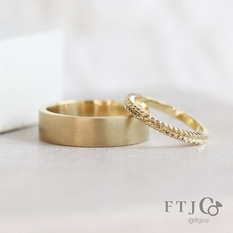 Did this pair of yellow gold wedding bands stop you in your tracks? They are gorgeous! You're looking at a wide Flat Band with a textured Euro Wheel finish, and our Petite Ceres Band. There's something about seeing these two rings together that is deeply satisfying... perhaps it's the contrast between the flat textured surface of the wide band and the shiny sculptural features of the narrow ring. Each ring serves to enhance the qualities of the other, yet they're united by their shared yellow... Two Rings Together, Texture Contrast, Sculptural Ring, Leaf Wedding Band, Gold Wedding Bands, Wide Wedding Bands, Two Rings, Yellow Gold Wedding Band, Gold Wedding Band