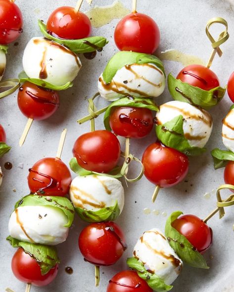 Caprese Skewers Recipe (with Balsamic Glaze) | The Kitchn Light Bites For Party, Mini Caprese Skewers, Caprese Appetizer Bites, Tomato And Mozzarella Appetizer, Party Skewers Appetizers, Skewer Snacks, Caprese Skewers Appetizers, Caprese Cups, Bbq Appetizer Ideas