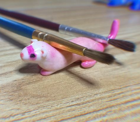 small, pink polymer clay ferret that can be used as a brush or pen holder Polymer Clay Ferret, Clay Ferret, Paint Brush Holder, Paint Brush Holders, Polymer Clay Animals, Brush Holder, Clay Animals, Clay Figures, Polymer Clay Creations