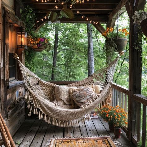 Relaxing outdoor hammock surrounded by hanging flowers and warm lighting, perfect for unwinding in nature. Hammock Front Porch, Hammock In House, Porch With Hammock, Hammock In Room, Porch Hammock, Room Hammock, Net Hammock, Indoor Hammock, Hanging Chair Outdoor