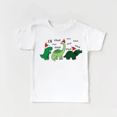 A fun and cheerful tshirt for the holiday season! Wear it while wrapping presents, caroling, picking out your christmas tree or cuddled up at home watching a christmas movie. Dinosaur Fa Rawr Rawr Christmas Tshirt, funny christmas, matching christmas shirt, matching dinosaur shirts, dinosaurs Christmas Toddler Shirt, Toddler Christmas Shirt, Dino Shirt, Holiday Graphics, Christmas Shirts For Kids, Matching Christmas Shirts, Family Outings, Dinosaur Shirt, Christmas Tshirt