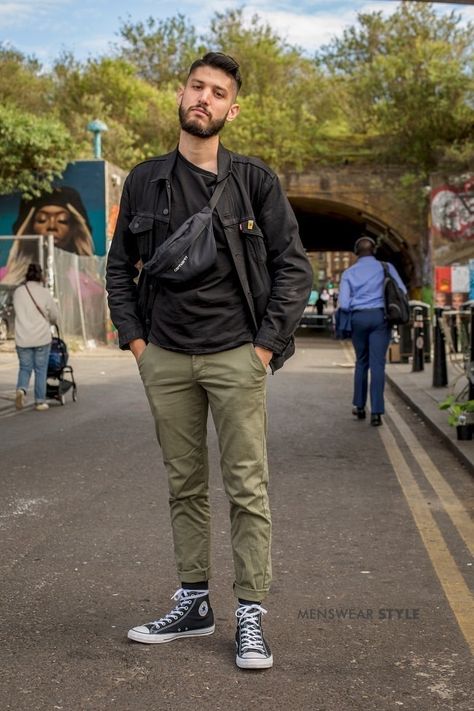 A Street Style Picture of Gianmarco on the streets of London in 2019 wearing Black Converse High Tops, Green Chinos, Black Denim Jacket, and Carhartt Shoulder Bag. High Top Converse Outfits Men, Converse Men Outfit, Converse Outfit Men Street Style, Carhartt Shoulder Bag, Black Converse Outfit Men, Black Converse High Tops, Converse Outfit Men, High Tops Outfit, Mode Converse