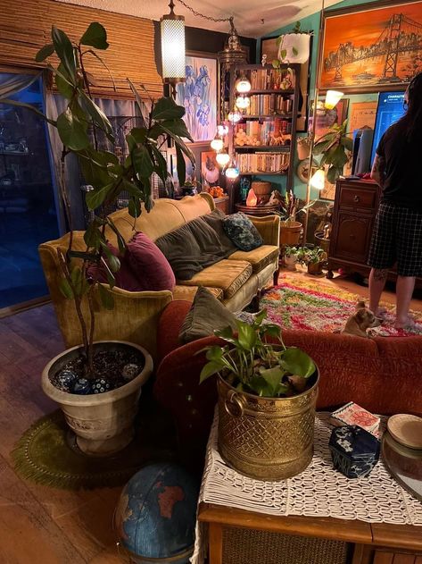 Maximalist Basement Ideas, Busy Interior Design, Hanging Decor Ceiling, 90s Whimsigoth Home, Indie Apartment Aesthetic Living Room, Clutter Core Living Room, Witchy Cottagecore Aesthetic Living Room, Studio Ghibli Apartment Aesthetic, Cluttered Home Aesthetic