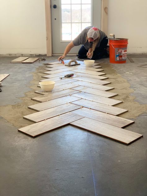 Laying Tile Floor, Diy Herringbone Floor, Deconstructed Chairs, Diy Floors, Herringbone Tile Pattern, Tile Floor Diy, Wood Ceramic Tiles, Herringbone Tile Floors, How To Lay Tile