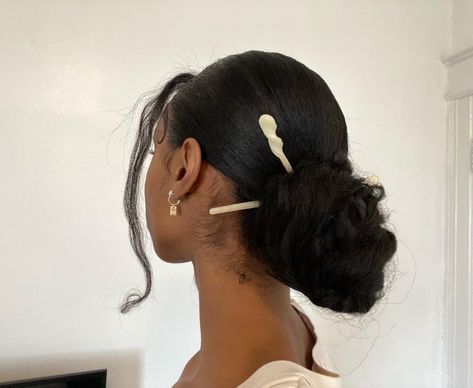 #hair #hairinspo #afrohair #bun #sleekbun #silkpress #easyhairstyle #lowbun Slick Back Bun With Chopsticks, Slick Back Hairstyles Dark Hair, Black Hair Low Bun, Low Bun Hairstyles For Black Women Prom, Low Bun Black Hair, Hair Stick Aesthetic, Slik Low Bun Hairstyles, Prom Low Bun Hairstyles, Asian Bun Hairstyles