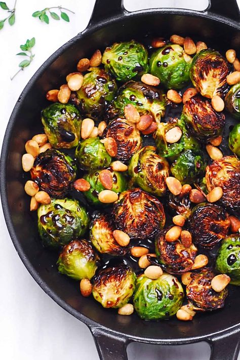 Roasted Brussels Sprouts with Balsamic Glaze and Pine Nuts in a cast-iron pan Christmas Vegetables Side Dishes, Balsamic Brussel Sprouts, Brussel Sprout Recipes Roasted, Roasted Brussels Sprouts, Sprout Recipes, Brussels Sprouts Recipe, Toasted Pine Nuts, Veggie Side Dishes, Balsamic Glaze