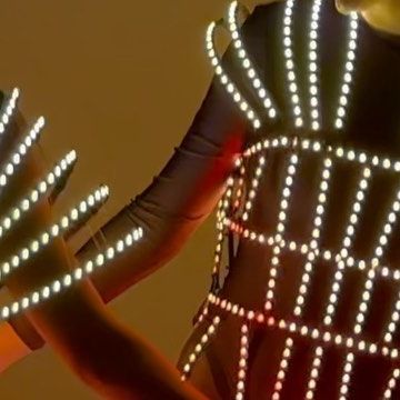 Custom LED & Mirror Costumes on Instagram: "LED light up dress is one of the most impressive and memorable outfits for dancers, musicians, singers and other entertainment artists working on stage, at nightclubs, meeting guests near a photozone or shooting a video. Design by @etereshop ⠀ Contact us to order: sales@etereshop.com Whatsapp +48 665 486 586 #eventprops#festivallook #rainbowmask #performers #showgirls #burningman #festival #hype #trendy #festivalfashion #fashionstyle #allfordance #dancewear #braziliancostume #dancecostume #danceshow #costumesfordancers #showbusiness #showproduction #showperformance #artisticdesign #stageperformance #showteam" Light Up Dress, Burningman Festival, Mirrored Costume, Light Up Dresses, Event Props, Video Design, Led Mirror, Dance Costumes, Artist At Work