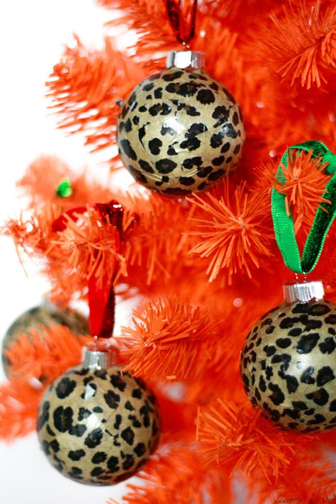 Hung with glitter ribbon, these DIY leopard print ornaments are a super glam addition to your Christmas tree! Easy to make modge podge tissue paper Christmas ornaments! #christmas #diyornaments #leopardprint Cheetah Ornaments Diy, Diy Leopard Print, Leopard Print Christmas, Glam Christmas Tree, Easy Christmas Tree, Big Christmas Tree, Christmas Decorations Cheap, Paper Christmas Ornaments, Glam Christmas