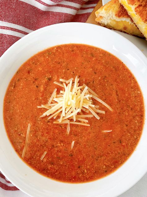 This tomato Parmesan soup is the perfect blend of convenience and deliciousness. With simple ingredients, it's ready in minutes for a cozy meal. Enjoy it on its own or paired with your favorite side dish! Creamy Parmesan Tomato Soup, Tomato Parmesan Soup, Quick Tomato Soup, Easy Tomato Soup Recipe, Tomato Parmesan, Parmesan Soup, Roasted Tomato Soup, Tomato Basil Soup, Tomato Soup Recipes