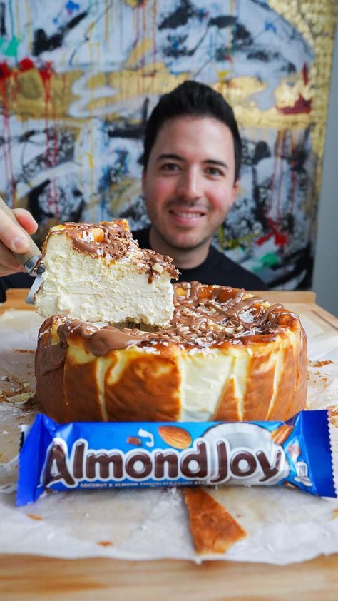 Nico Norena on Instagram: "ALMOND JOY CHEESECAKE 😍 What should the next flavor be? #succulentbite Pre-order my new recipe book! It has 60 of my favorite dessert recipes, from cheesecakes to crepes and easy ice cream! Ships worldwide on Amazon! 🔥 Check my page for link Ingredients • 40oz cream cheese (at room temp) • 1 cup granulated sugar • 1 tbsp vanilla extract • 3 eggs • 1 cup heavy cream • 1 cup coconut cream • 1/3 cup cake flour • 1/2 tsp baking powder Topping: • Shaved coconut • ... Heavy Cream Cake, Almond Joy Cheesecake Recipe, Almond Joy Cheesecake, Almond Joy Cake, Cheesecake Mix, Chocolate Slice, Easy Ice Cream, Cheesecake Cake, Almond Joy