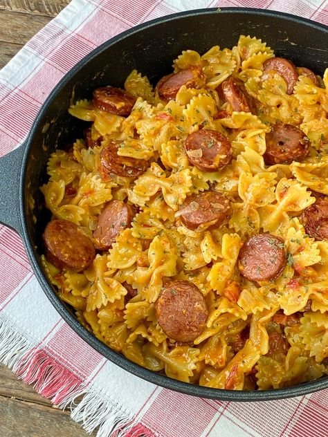 Cajun Sausage Pasta - Plowing Through Life Cajun Pasta With Sausage, Sausage Crostini, Sausage Pasta Dinner, Cajun Pasta Recipes, Bow Tie Pasta Recipe, Cajun Sausage Pasta, Sausage Pasta Recipe, Smoked Sausage Pasta, Cajun Sausage