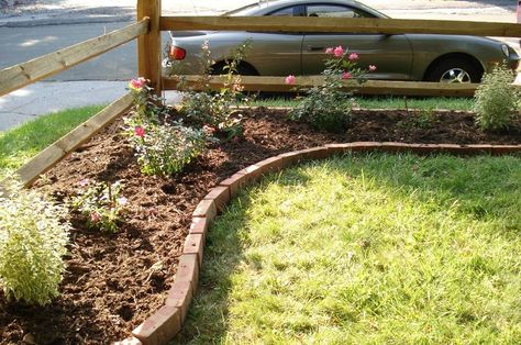 corner lot landscaping ideas | and this is how it looked after a hard winter with way too much snow: Corner Landscaping, Landscaping Trees, Front Yard Fence, Landscaping Garden, Fence Landscaping, Brick Patios, Diy Yard, Corner Lot, Front Yard Garden