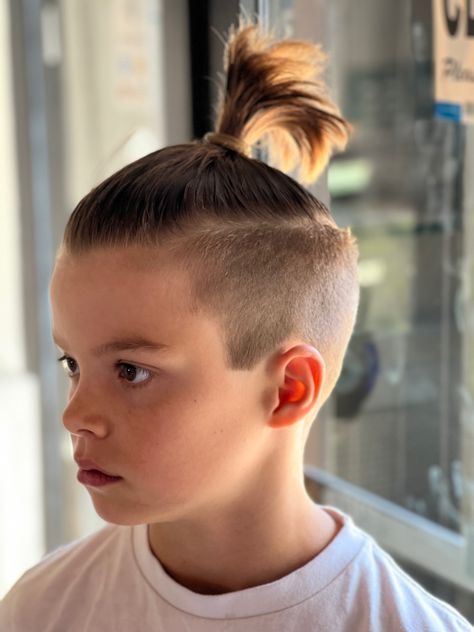 Kids Man Bun Boys, Boy Undercut Hair Kids, Toddler Man Bun, Boys Man Bun Haircut, Boys With Ponytails, Boys Bun, Little Boys Haircut Trendy, Boys Undercut Hairstyle Long, Kids Man Buns