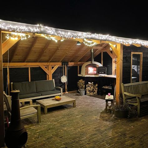 Pergola With Pizza Oven, Ooni Pizza Oven Outdoor Setup, Patio With String Lights, Outdoor Pizza Oven Area, Kitchens With Fireplaces, Cozy Outdoor Patio, Backyard Kitchen Ideas, Rustic Outdoor Spaces, Stone Pizza Oven