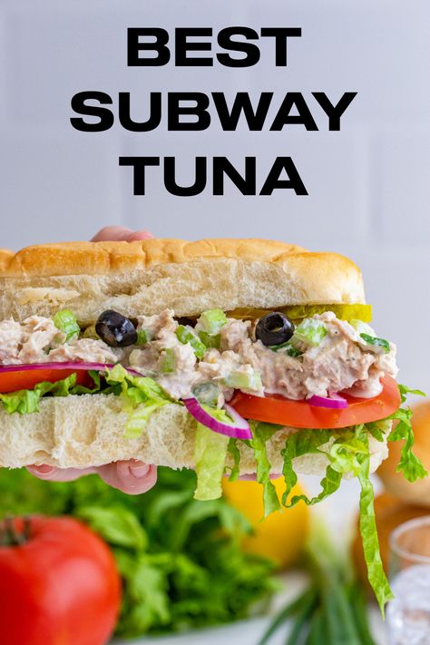 A Subway tuna sub being held in the air with tomatoes, olives, celery, onions and lettuce. Ultimate Tuna Sandwich, Tuna Subs, Copycat Subway Tuna, Subway Sandwich Ideas Copycat Recipes, Subway Tuna Recipe, Subway Tuna Salad Recipe, Tuna Sandwich Ideas, Subway Tuna Recipe Copycat, Best Subway Sandwich Ideas