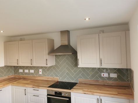 Sage Green Herringbone Kitchen Tile, White Kitchen Sage Tiles, White Kitchen Sage Walls, Sage Green Kitchen Tiles Backsplash, Splashback Ideas For White Kitchen, Sage Tiles Kitchen, White Kitchen Green Tiles, Sage Green Kitchen Tiles, Green Kitchen Small