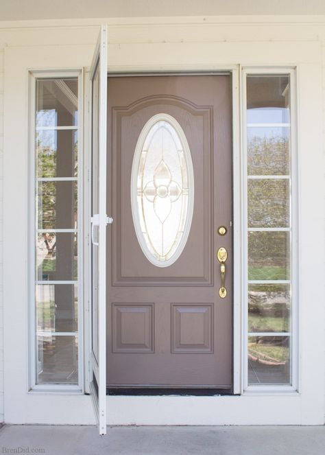 Turn an ugly duckling front door into a beauty with this easy (and affordable) front door painting project.Giving your front door a mini makeover can brighten y… Front Door With Oval Glass Window, Door Redo, Yellow Front Doors, Door Painting, Front Door Makeover, Brown Doors, Primitive Homes, Front Doors With Windows, Painted Front Doors