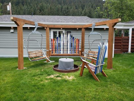 Ski lift chairs and skis used to make backyard gathering area around the solo stove firepit Old Skis Ideas Front Porches, Backyard Ski Park, Repurposed Skis, Ski Chair Lift Bench, Old Ski Lift Chair, Cabin Patio, Ski Lift Chair, Ski Chair, Ski House Decor