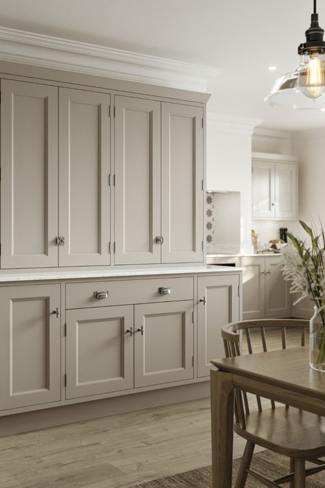 In need of grey kitchen inspiration or kitchen decor ideas? Our new Elmbridge Pebble In-Frame Kitchen Dresser will give you all the beaded shaker, luxury kitchen inspiration that you need. With its solid timber doors and wood grain painted finish it is perfect for any kitchen design. This grey shaker kitchen is perfect for your grey kitchen ideas with exposed hinges creating a beautiful bespoke kitchen design. Finish with chrome kitchen hardware and white marble countertops. Cashmere Kitchen, Howdens Kitchens, Серая Кухня, Cupboard Door Knobs, Chrome Effect, Neutral Kitchen, Kitchen Dresser, Shaker Style Kitchens, Shaker Kitchen