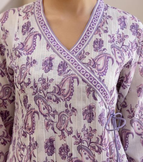 Summer 2024 - New arrivals! Our Paisley Wrap Kurta is a paradise of print in a lively purple. Luxuriant botanical motifs dance gracefully across the white base, weaving a tapestry of femininity and ethnic grace. Explore more from our ‘Lavender Paisley’ collection. www.cottonsjaipur.com [ Cottons Jaipur, Cotton, Lavender, Paisley, Handmade Kurtas, Everyday-wear, Summer staples ] #cottons #cottonsjaipur #newarrivals #floral #summer #summer2024 #handcraftedkurtas #comfortfits #cottonsuitset ... Printed Kurtis Design, Printed Kurta Neck Design Cotton, Short Kurta Pattern, Lavender Kurti, Cottons Jaipur, Kurta Ideas, Neck Patterns For Kurtis, Handwork Design, Cotton Lavender