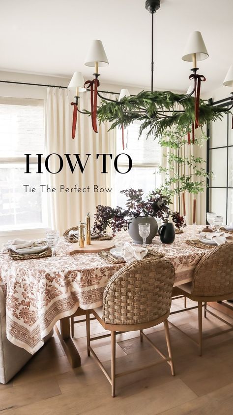 Let’s tie the perfect bow! Last year I used this method to finish holiday wreaths, garland, and gifts. This year I decided to add velvet… | Instagram Bows On Chandelier Christmas, Bows On Chandelier, Garland On Chandelier, Christmas Chandelier Ideas, Round Aesthetic, Christmas Chandelier, Bow Garland, Dining Table Light, Christmas Open House