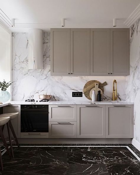 a small contemporary greige kitchen with shaker cabinets, a white marble backsplash and countertops and built in appliances is wow Greige Kitchens, Neoclassical Kitchen, Greige Kitchen Cabinets, Neutral Kitchen Designs, White Marble Backsplash, Greige Kitchen, Серая Кухня, Beige Kitchen, Kitchen Decor Ideas