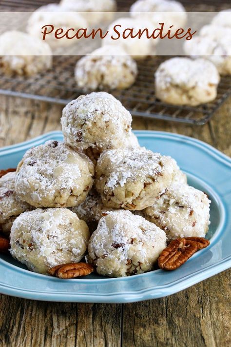 Pecan Sandies are a delicious Christmas treat that are a must make for any holiday cookie platter. I love the nutty crunch. The powdered sugar makes them all festive too with a kiss of “snow.” In fact, my daughter got all excited thinking it had somehow snowed in the house right on the cookies. This... Pecan Sandies Cookies, Classic Snowball Cookies, Sandies Recipe, Sandies Cookies, Mexican Wedding Cookies Recipes, Wedding Cookies Recipe, Pecan Snowballs, Pecan Snowball Cookies, Snowball Cookie Recipe