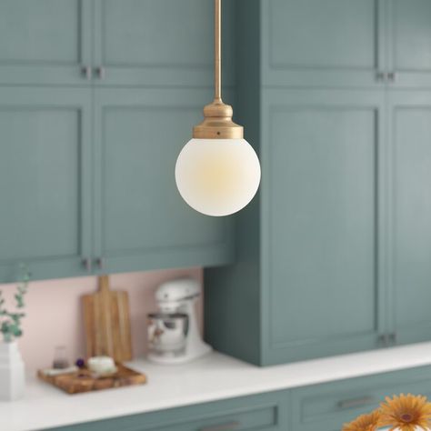 Though it may be small in size (it measures just 5.75'' H x 6'' W x 6'' D!), this pendant still packs a big punch! Because of its smaller stature, it's perfect for illuminating a compact play area or bringing a warm glow to your kiddo's bedroom while hanging over their nightstand. Its metal canopy and downrod supports a single light while adding a pop of polish, then it's highlighted by a glass globe shade in white. Small Hanging Lights, Glass Shade Pendant Light, Turtle Bay, Globe Pendant Light, Metal Canopy, Lighting Options, Drum Chandelier, Kitchen Pendants, Linear Chandelier