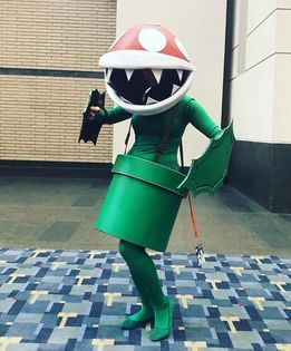 Cosplay in America - I came up with the idea of Pirahna Plant when my fiance and I wanted to do a Super Smash Bros Ultimate group with our friends for Otakon! We wanted to do odd characters so he chose Olimar, and I chose Piranha Plant. I liked the idea of challenging myself on how to make myself into this iconic plant haha  I used EVA foam to make the head, leaves, and pipe, and worked on it off and on for about 3 months. The green outfit I wore was just constructed by items I found on Amazon, but I'm really proud of how simple but effective my costume became.   I started cosplaying 9 years ago, and I can't imagine my life without it. Cosplay has shown me what it's really like to belong to a community, and I couldn't be more thankful.I've met so many amazing people, it's how I met the lov Super Smash Bros Cosplay, Piranha Plant Costume, It Cosplay, Super Mario Costumes, Piranha Plant, Playing Dress-up, Mario Bros., Green Outfit, Cosplay Ideas