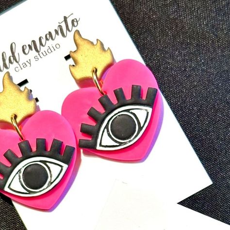 Wild Encanto on Instagram: "🧿❤️ Protect your heart with our stunning Evil Eye Heart Earrings! Handcrafted from lightweight polymer clay in vibrant colors, these earrings are the perfect accessory to add a pop of color to any outfit. Get yours today and ward off negativity with style! 🩷🧿  #EvilEyeEarrings  #WildEncanto  #HandcraftedJewelry  #ShopLocal" Protect Your Heart, Evil Eye Earrings, Pop Of Color, Shop Local, Heart Earrings, Evil Eye, Handcrafted Jewelry, Color Pop, Polymer Clay