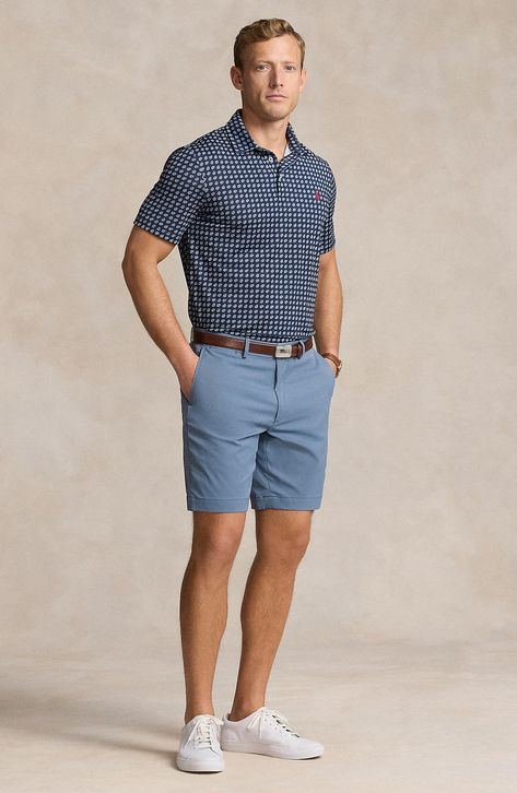 Classic and comfortable, these flat-front chino shorts feature plenty of easy-moving stretch and lots of pockets for holding small essentials. 8" inseam; 20" leg opening; 12" front rise; 14" back rise (size 32) Zip fly with button closure Front slant pockets; coin pocket; side-seam zip pockets; back button-welt pockets 89% recycled polyester, 11% polyester Machine wash, dry flat Imported Chinos Shorts Men Outfit, Ralph Lauren Preppy Men, Blue Shorts Outfit, Mens Shorts Outfits, Preppy Clothes, Blue Chinos, Short Men Fashion, Lots Of Pockets, Stretch Chinos