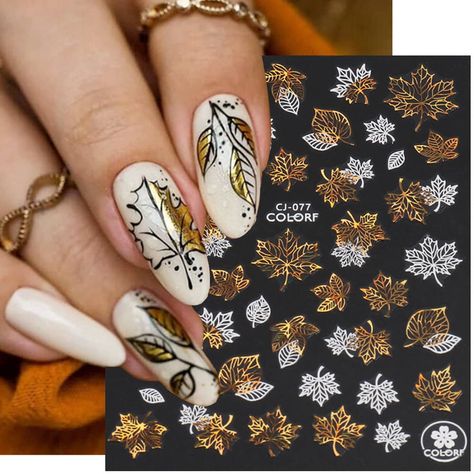 PRICES MAY VARY. Fall Nail Stickers - 9Pcs laser gold fall nail art stickers for nails include different kinds of leaves, different pattern and size. Eye-catching Nail Art - Our laser fall gold leaves nail design stickers include a lot of shining leaves, not only maple leaves for acrylic nails. It’s charming to see a gold leaves pattern on you finger nails or toe nails. Simple to Operate - Apply your favorite nail polish on your nails, then choose one of the fall nail stickers and carefully remo Fall Leaves Nail Art, White Nails With Gold, Thanksgiving Nail Art, Pinterest Trends, Gold Nail Art, Nail Art Stickers Decals, Winter Nail Art, Nail Patterns, Fall Nail Art